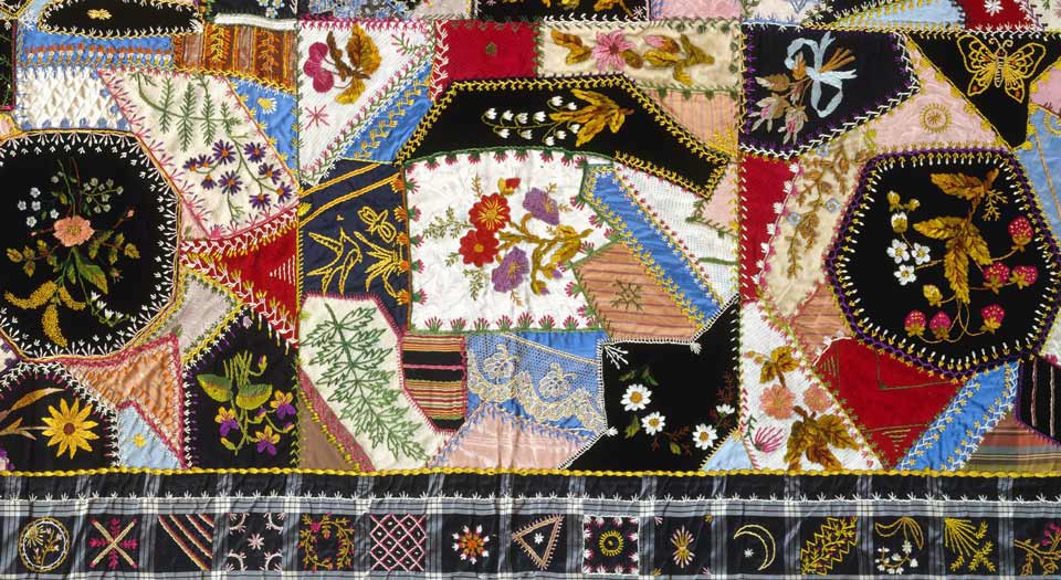 Detail of the above quilt, highlighting the embroidery and exotic stitchwork.