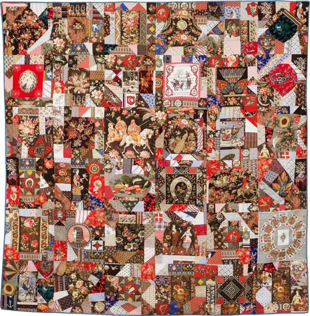 A crazy quilt with a smorgasboard of image-patterned fabrics. Knights, scenes of young love, Queen Elizabeth, playing cards, a horseshoe, hundreds of flowers…